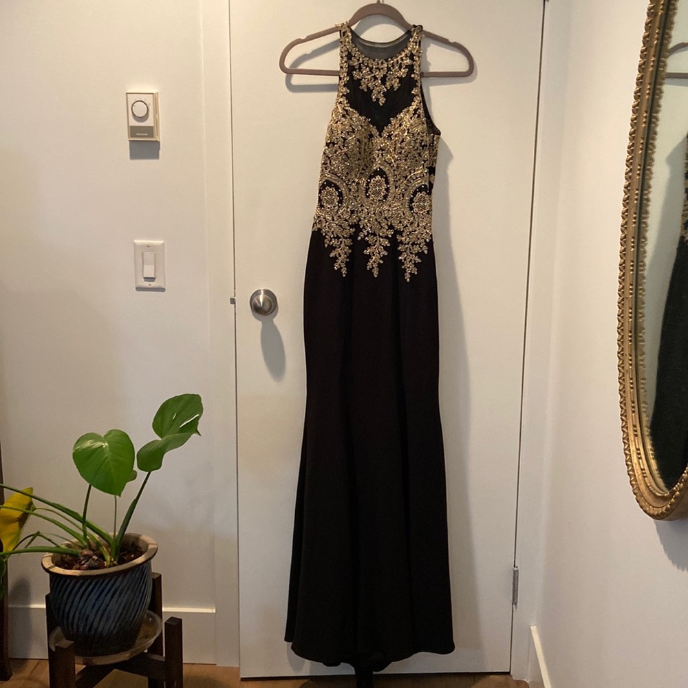Black formal gown with detailed gold embellishments, size 4